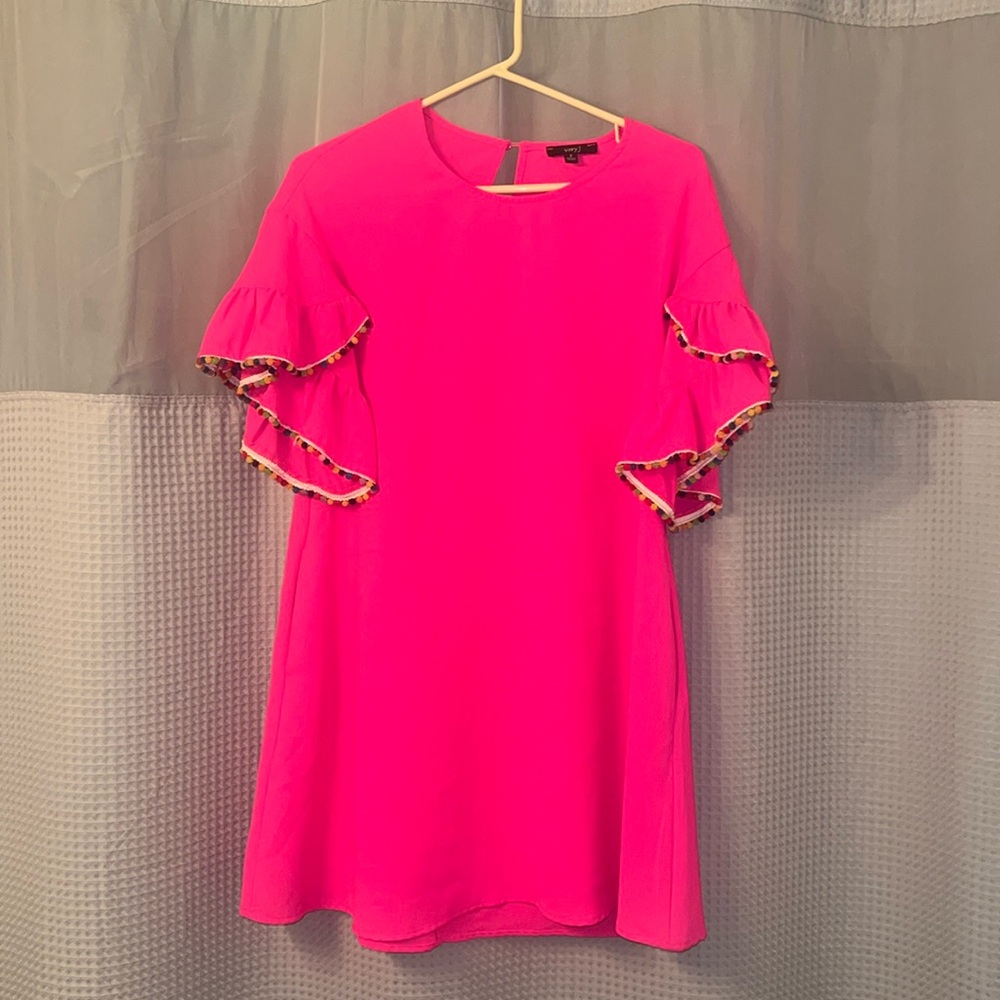 Pink pom-pom sleeve dress.